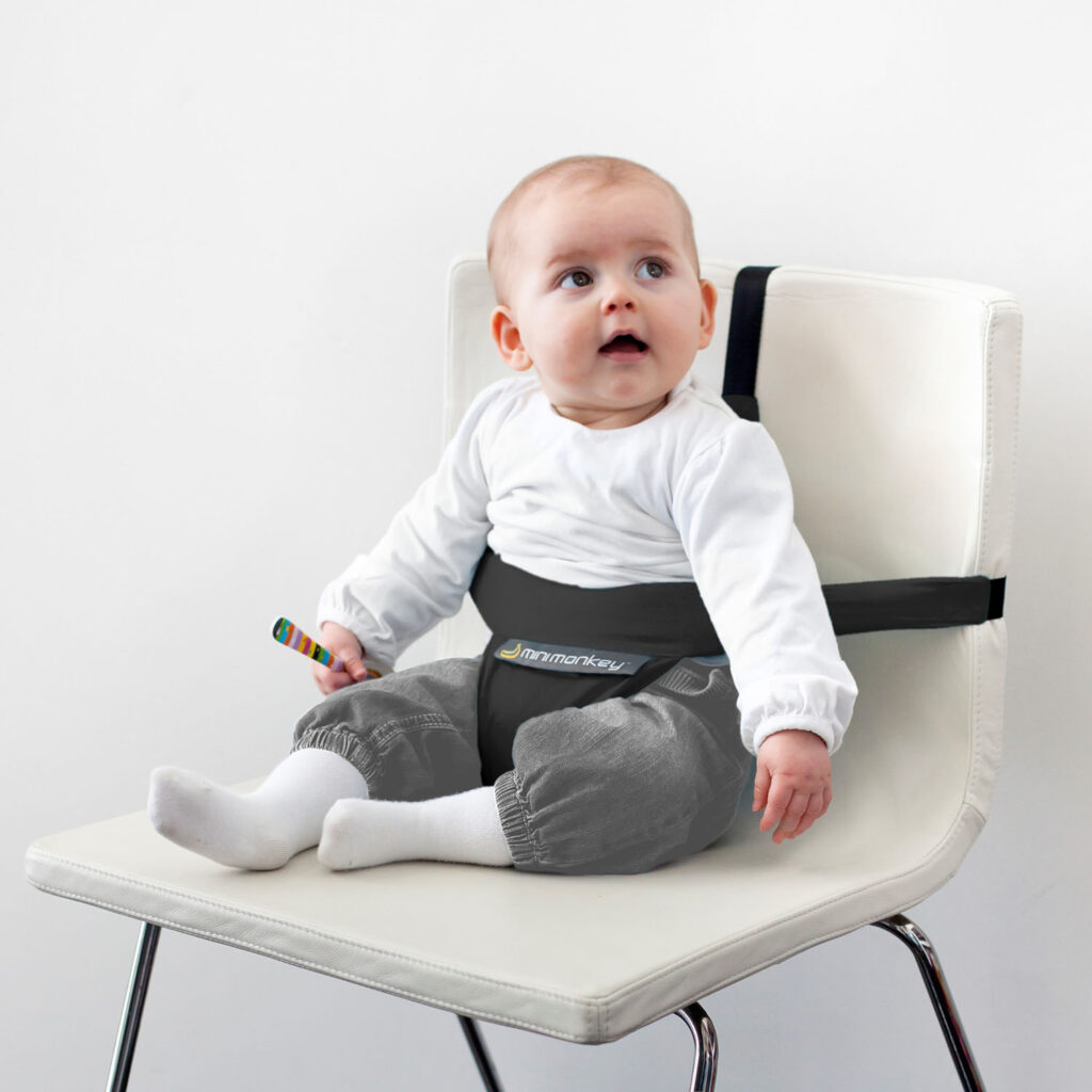 Bebé confortável e seguro na Cadeira de Refeição Portátil Mini Chair Minimonkey®